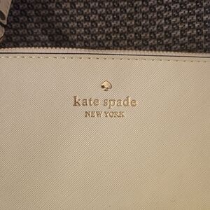 Cream colored Kate Spade Wristlet